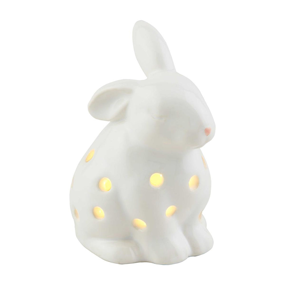 White ceramic bunny light-up sitter figurine with glowing polka dot cutouts for Easter home decor and night light.