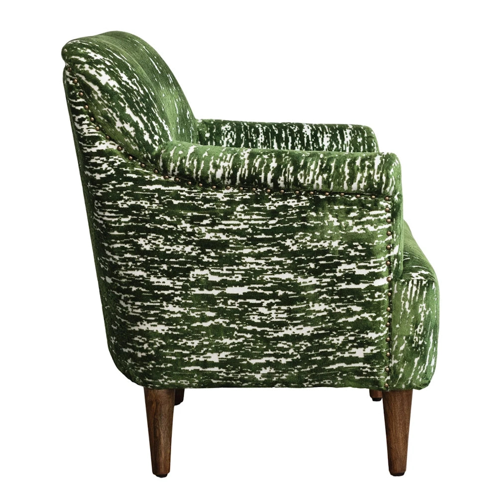 Green burnout velvet armchair with mango wood legs and studded trim, luxury upholstered seating for living rooms.