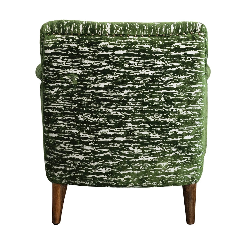 Green burnout velvet upholstered armchair with mango wood legs, seen from behind on a white background.