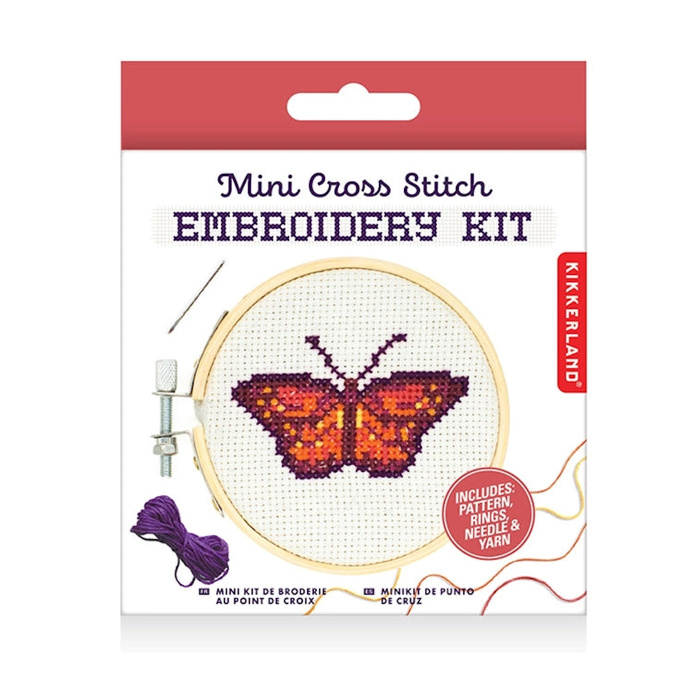 Kikkerland Mini Cross Stitch Embroidery Kit featuring a colorful orange and purple butterfly in a wooden hoop.