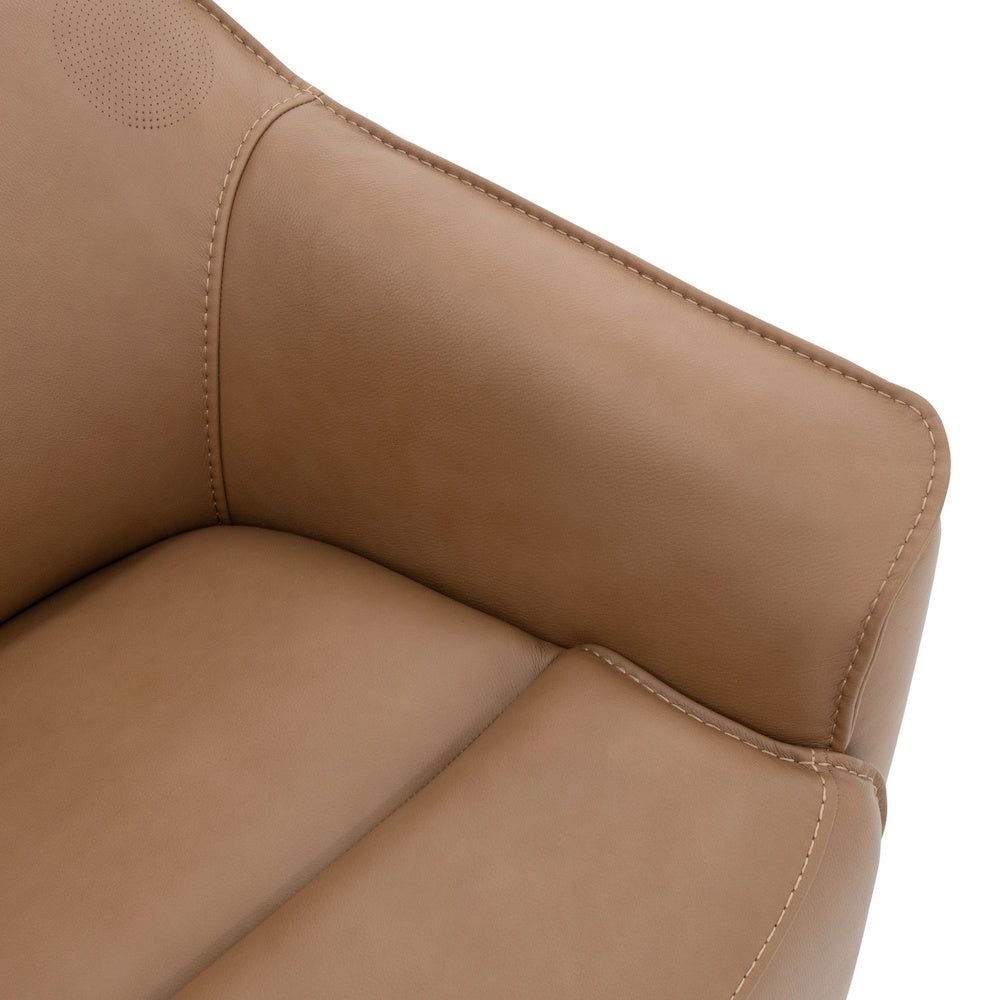 Close-up of a tan leather armchair showing detailed stitching on the armrest and seat cushion.