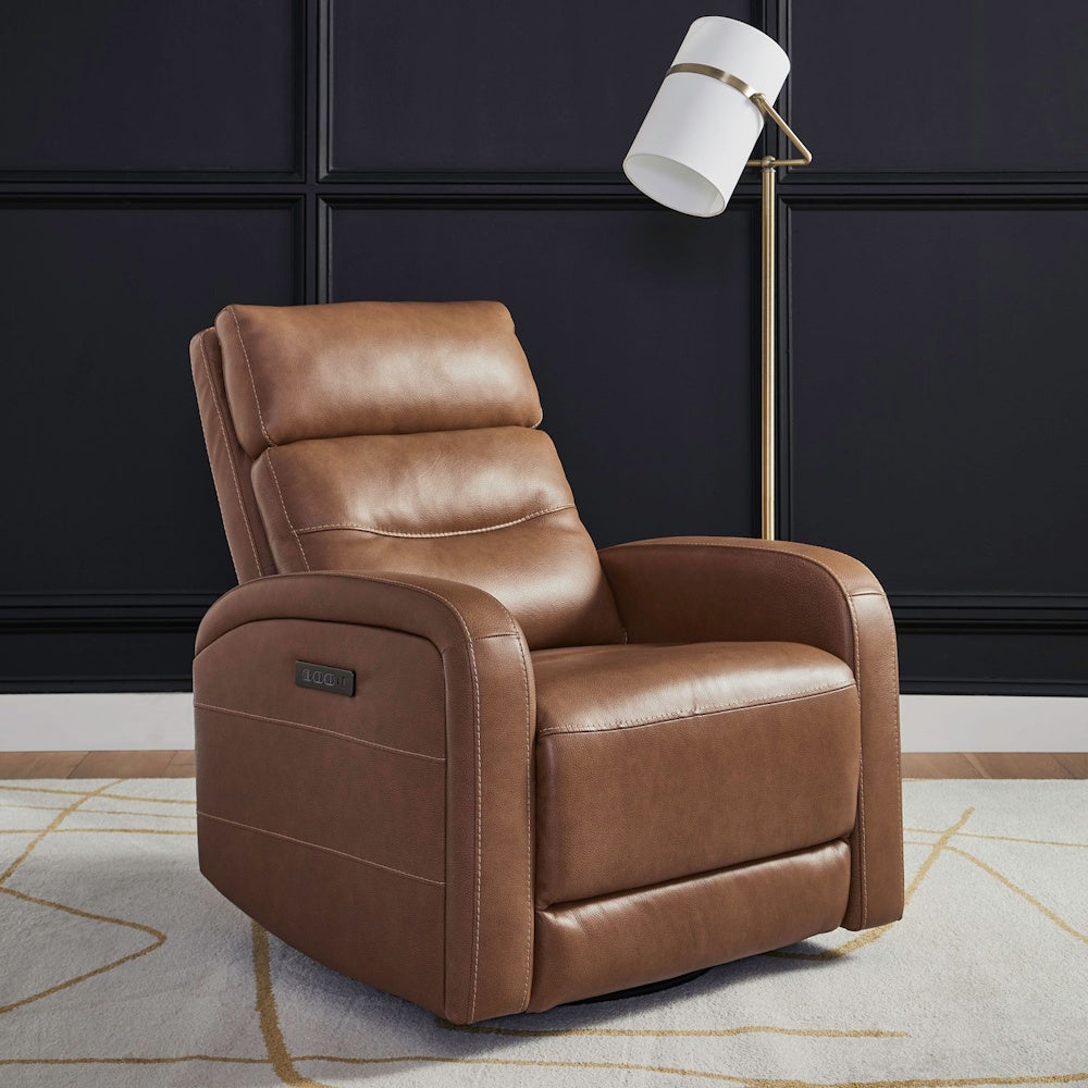 Brown leather power recliner armchair in front of a dark paneled wall with a modern floor lamp.