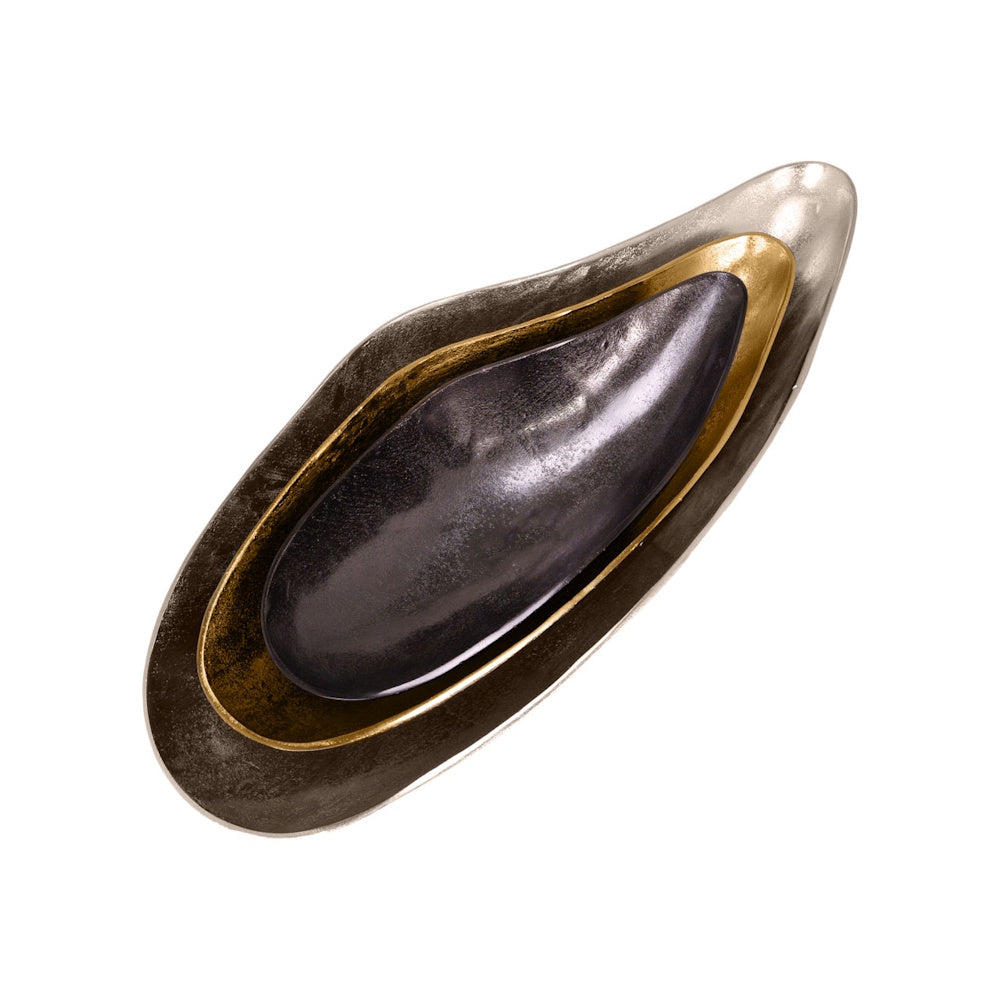 Top view of nested oval Camdin trays in metallic silver, gold, and textured black finishes on a white background.