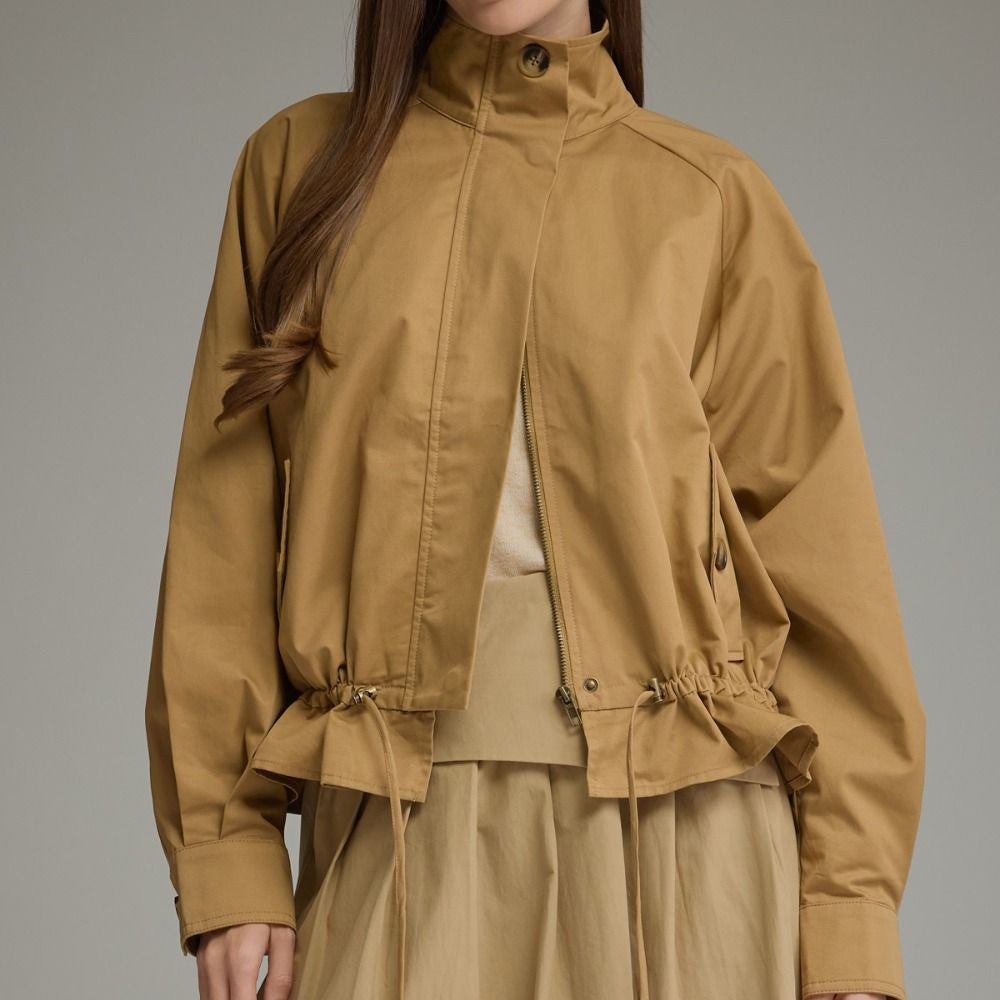Camel full-zip jacket featuring a high stand collar, drawstring hem, and long sleeves.