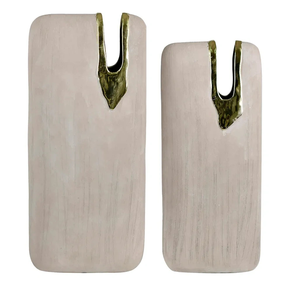 Two minimalist matte beige ceramic rectangular vases with gold-rimmed organic openings in varied heights on a white background.