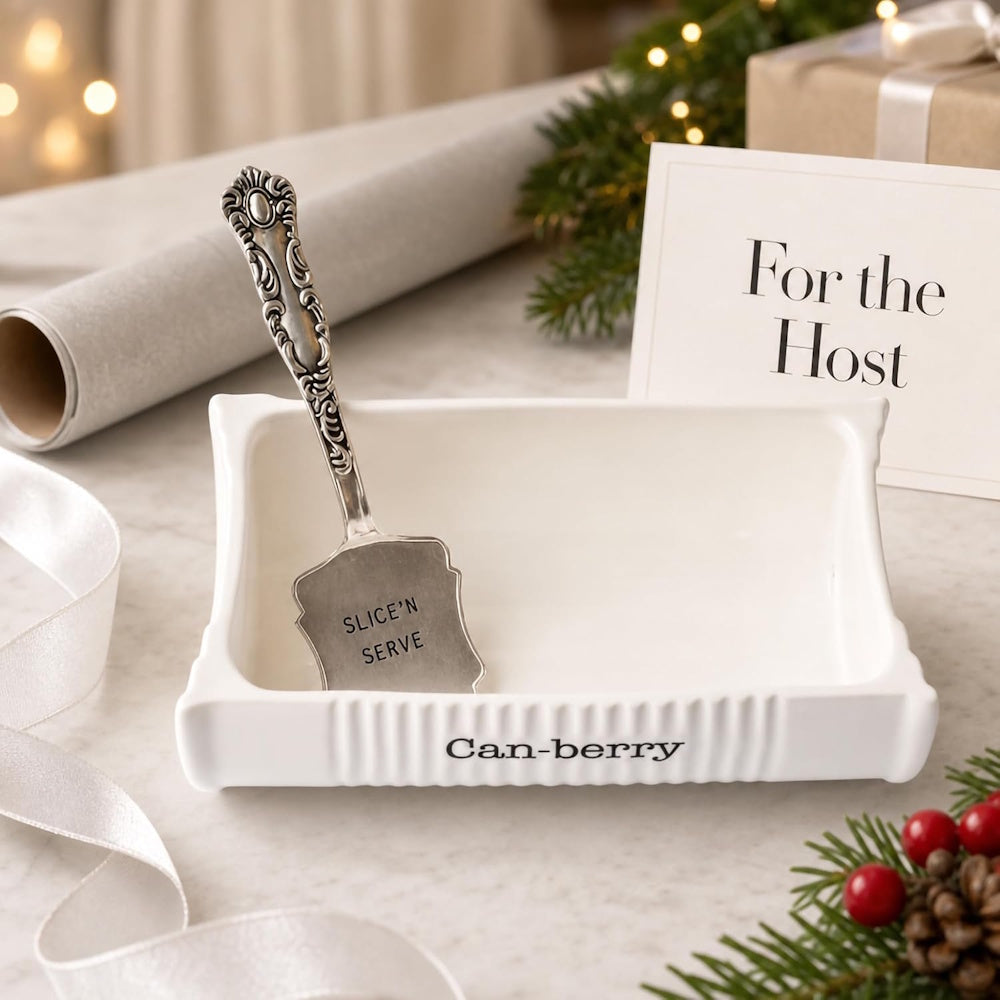 Empty white ceramic "Can-berry" dish with silver server next to a "For the Host" card.