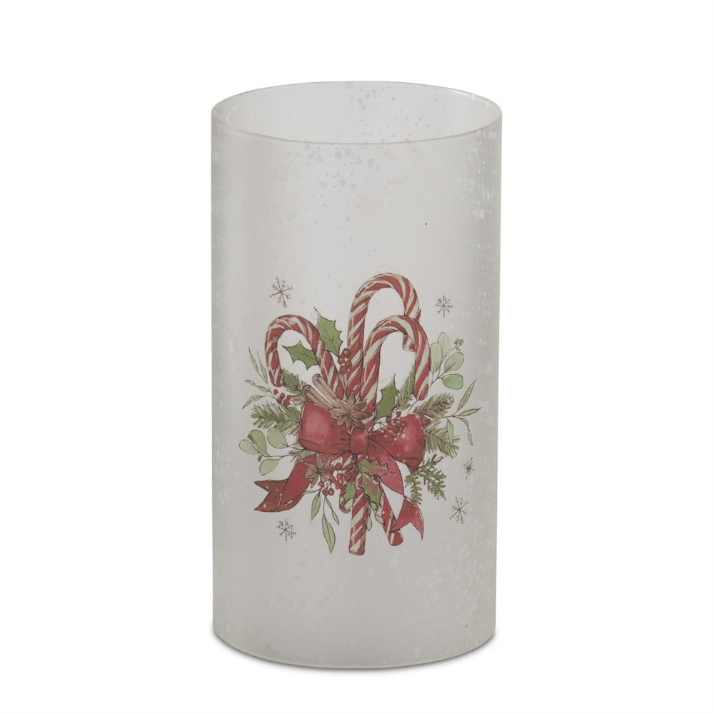Frosted glass candle slip cover featuring candy canes and a red bow.