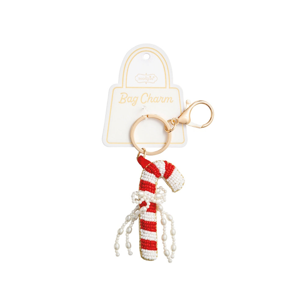 Beaded red and white candy cane bag charm with a gold clasp and pearl bow details.