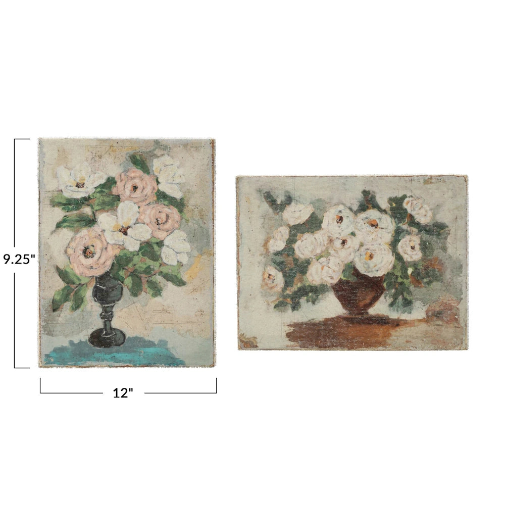 Two canvas wall art pieces featuring vintage-style floral paintings of white and pink roses in vases.