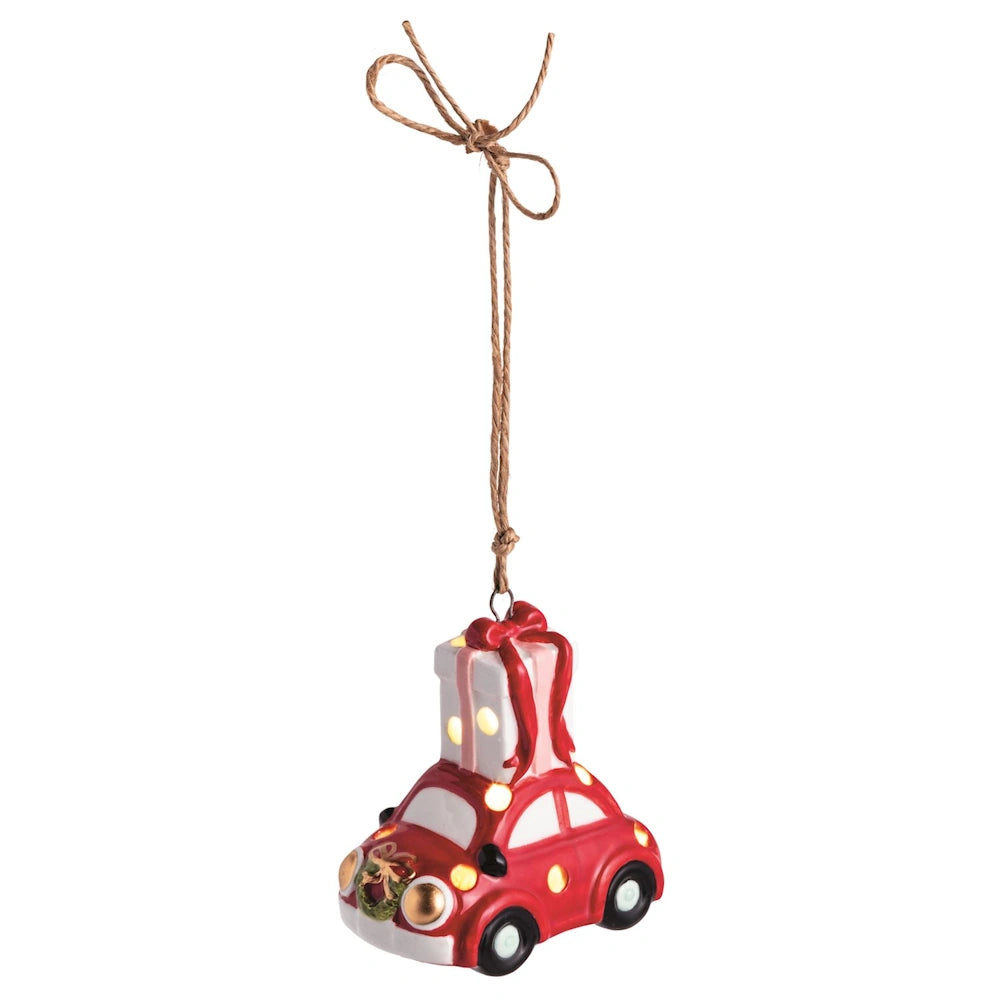 Light-up ceramic Christmas ornament of a red car with a giant wrapped gift on top.