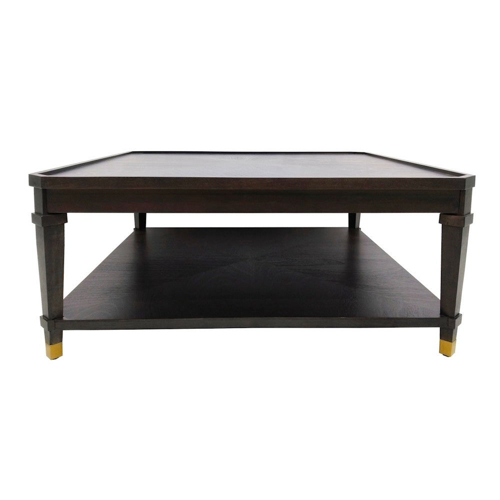 Dark wood square coffee table with a lower storage shelf and gold-tipped tapered legs on a white background.