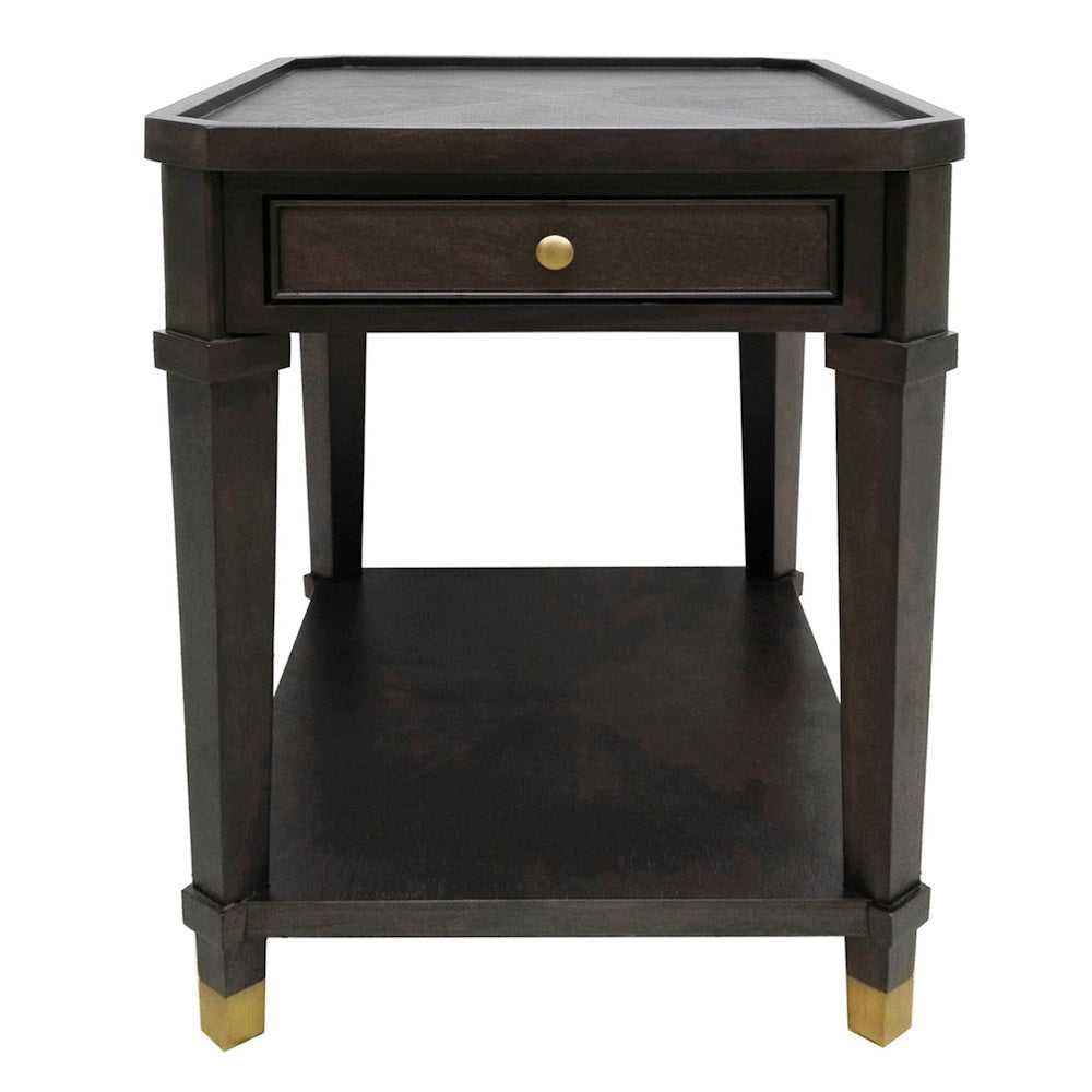 Dark wood end table with storage drawer, brass knob, and gold-tipped legs on white background.