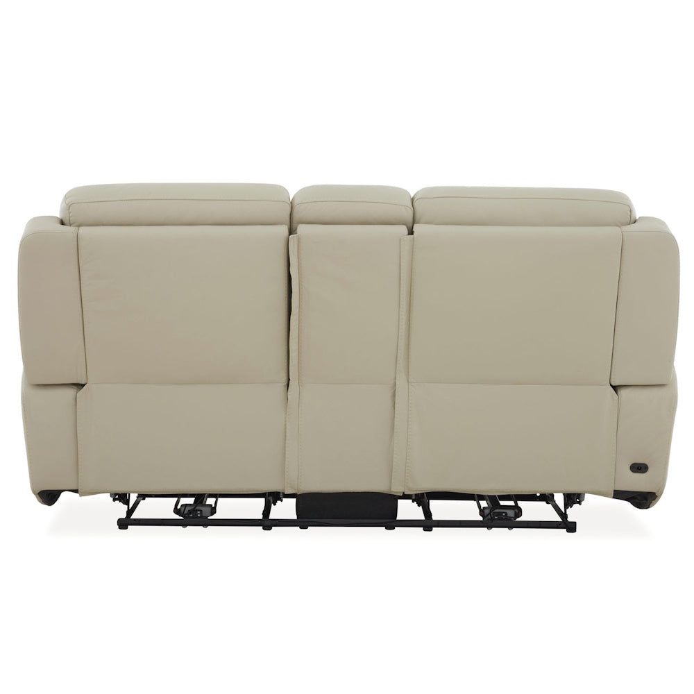 Rear view of cream leather power reclining loveseat with center console and visible reclining mechanism base.