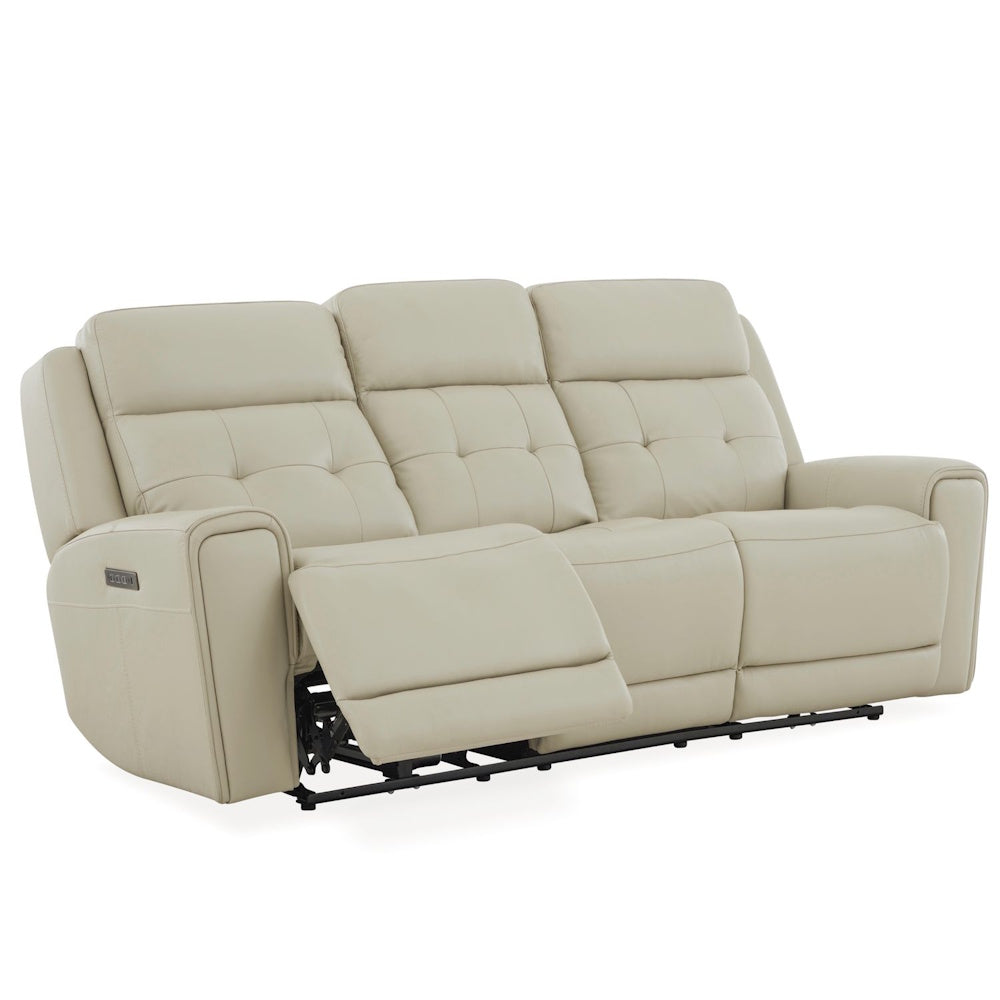 Cream leather power reclining sofa with tufted back cushions, extended footrest and padded track arms.