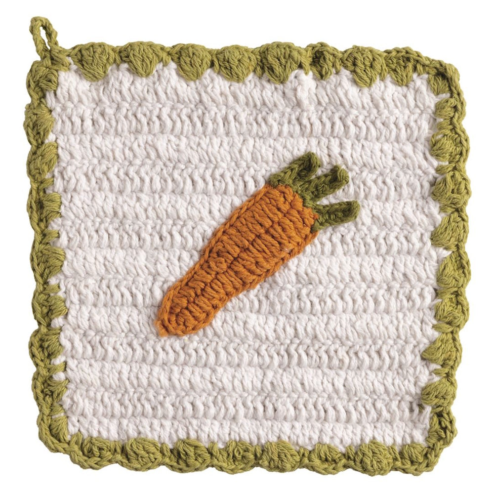 Handmade white crochet pot holder with a green scalloped border and an orange carrot appliqué for spring kitchen decor.