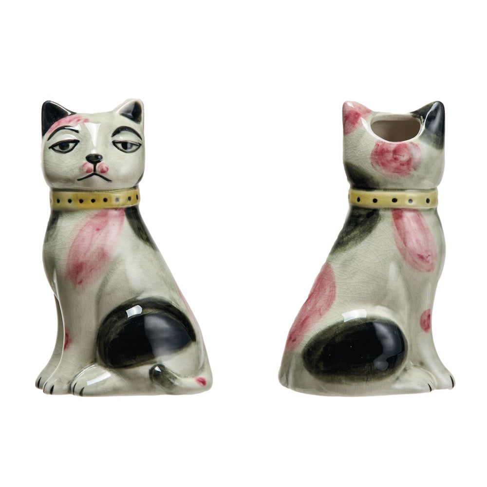 Two views of a small ceramic cat planter with a crackle glaze, featuring pink and black spots and a yellow collar.