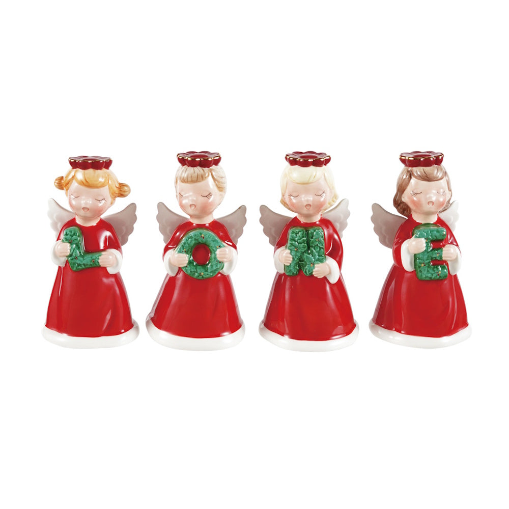 Four ceramic angel figurines in red dresses holding letter-shaped wreaths that spell NOEL.