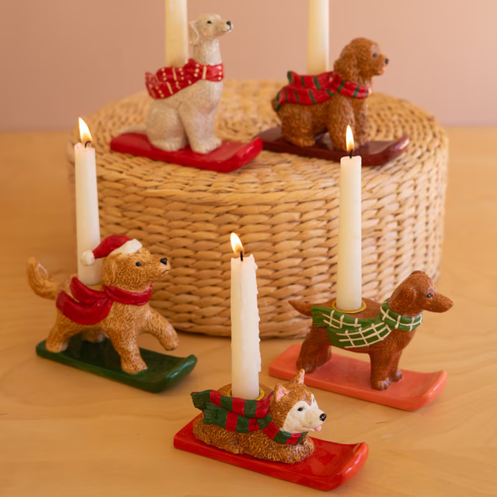 Set of ceramic holiday dog taper candleholders featuring various breeds wearing festive scarves.