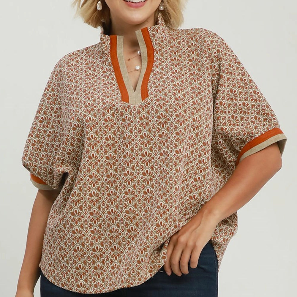 Chestnut pattern split-neck top with contrast trim and short dolman sleeves.