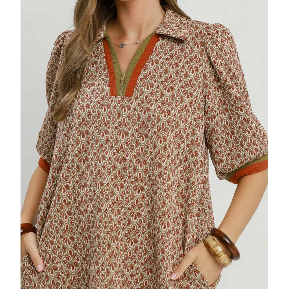 Chestnut geometric dress with a collared half-zip neckline and puff sleeves.