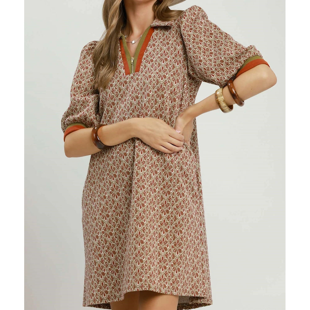 Chestnut geometric print shift dress with collared half-zip neckline and puff sleeves.