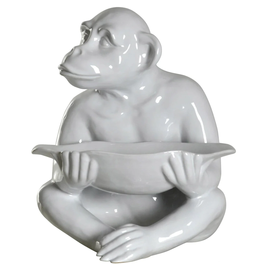 White ceramic monkey figurine holding a shallow bowl, elegant animal sculpture for modern home decor and organization.