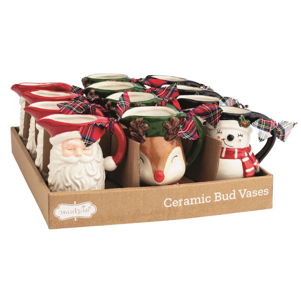 Display tray of Christmas ceramic bud vases shaped like Santa, a reindeer, and a snowman with bows.