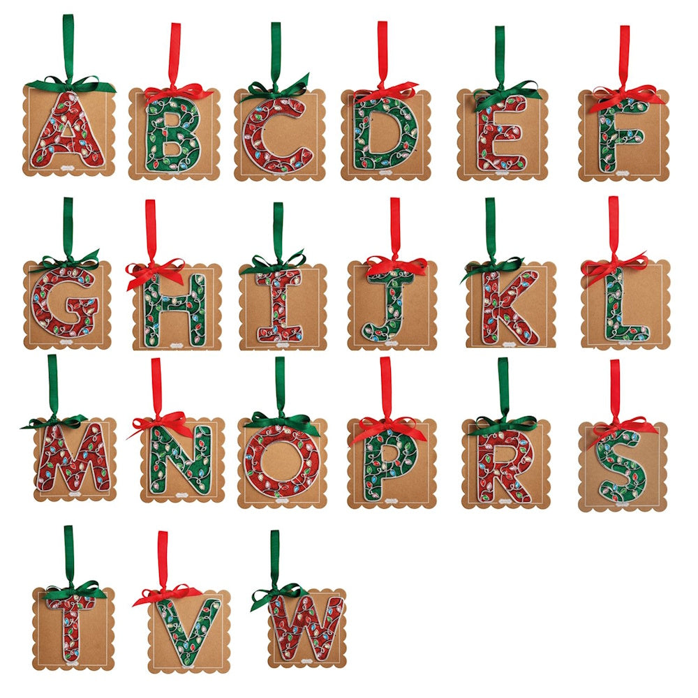 Square brown cutout Christmas ornaments featuring alphabet letters decorated with festive lights and hanging ribbons.