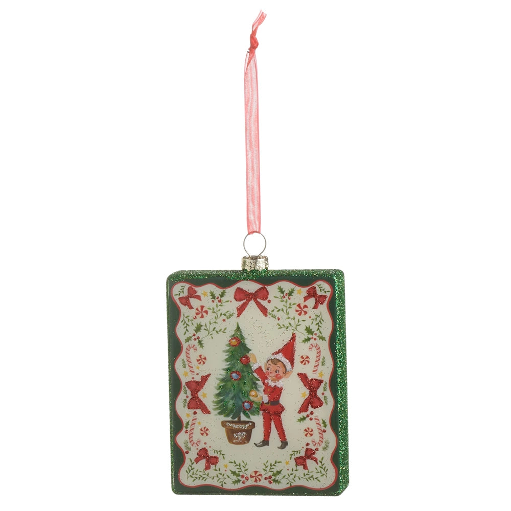 Front view of a rectangular glass Christmas ornament featuring a vintage elf decorating a tree.