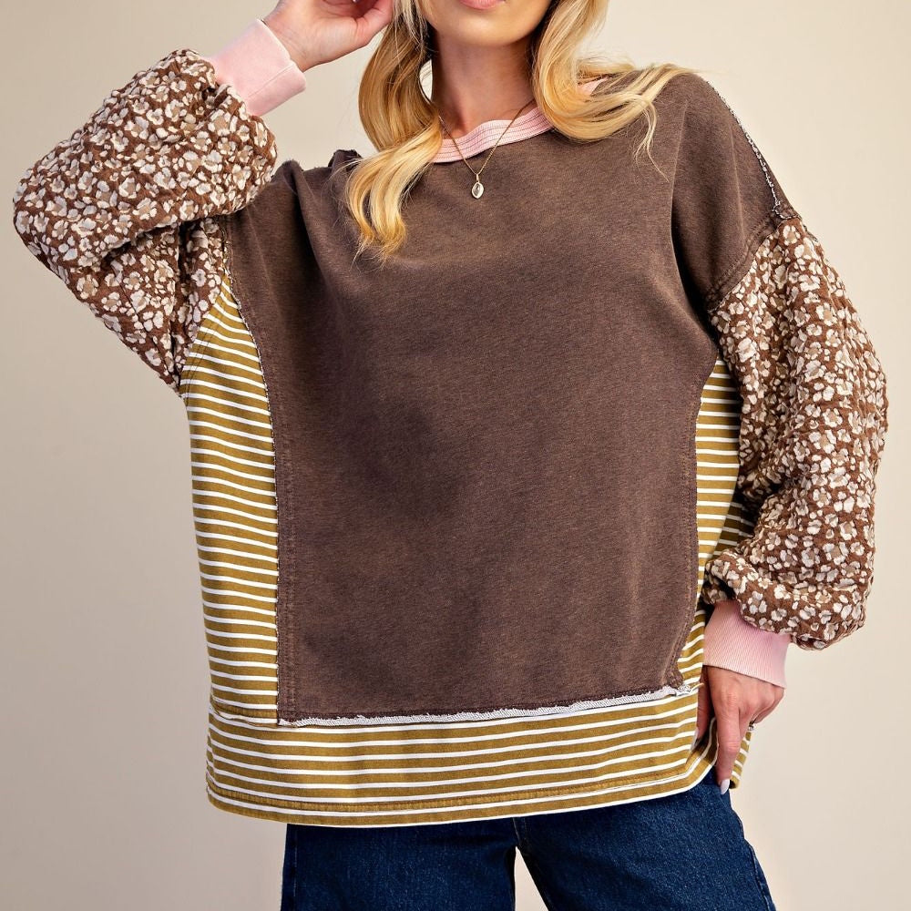 Coffee brown terry knit pullover featuring floral print sleeves, striped sides, and pink ribbed trim.