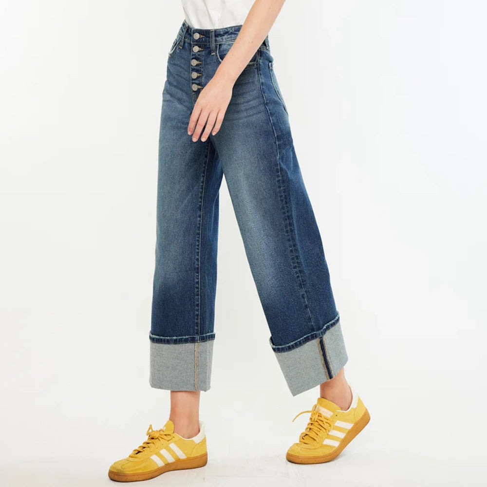 Ultra high-rise wide-leg crop jeans in dark wash with button fly and large cuffed hems.