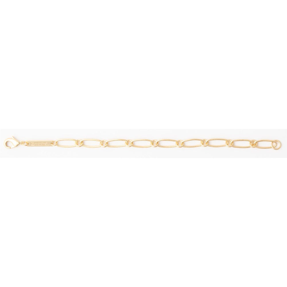 Gold paperclip link chain bracelet with a lobster clasp and rectangular metal logo tag.