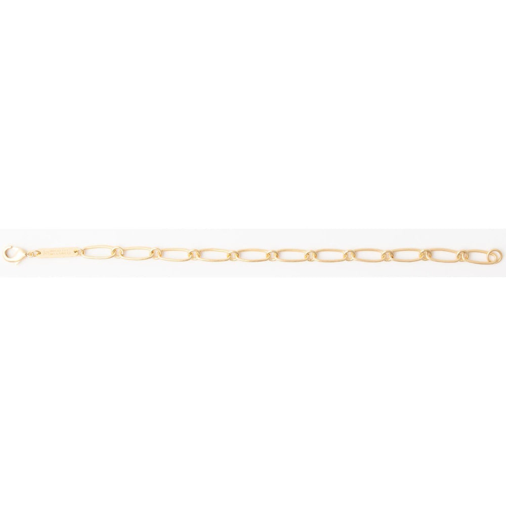 Gold paperclip link chain bracelet with a lobster clasp and rectangular metal logo tag.