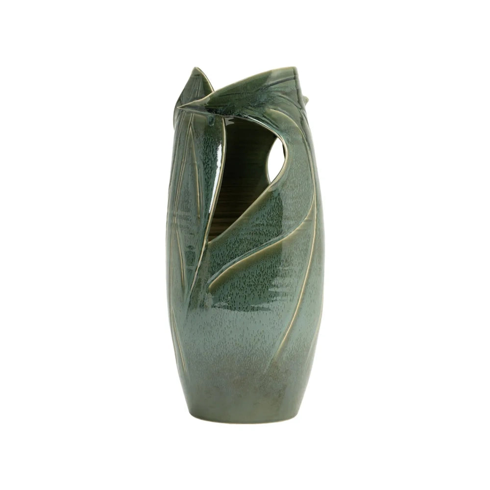 Green organic-shaped ceramic vase with a glossy glaze and a central cutout.
