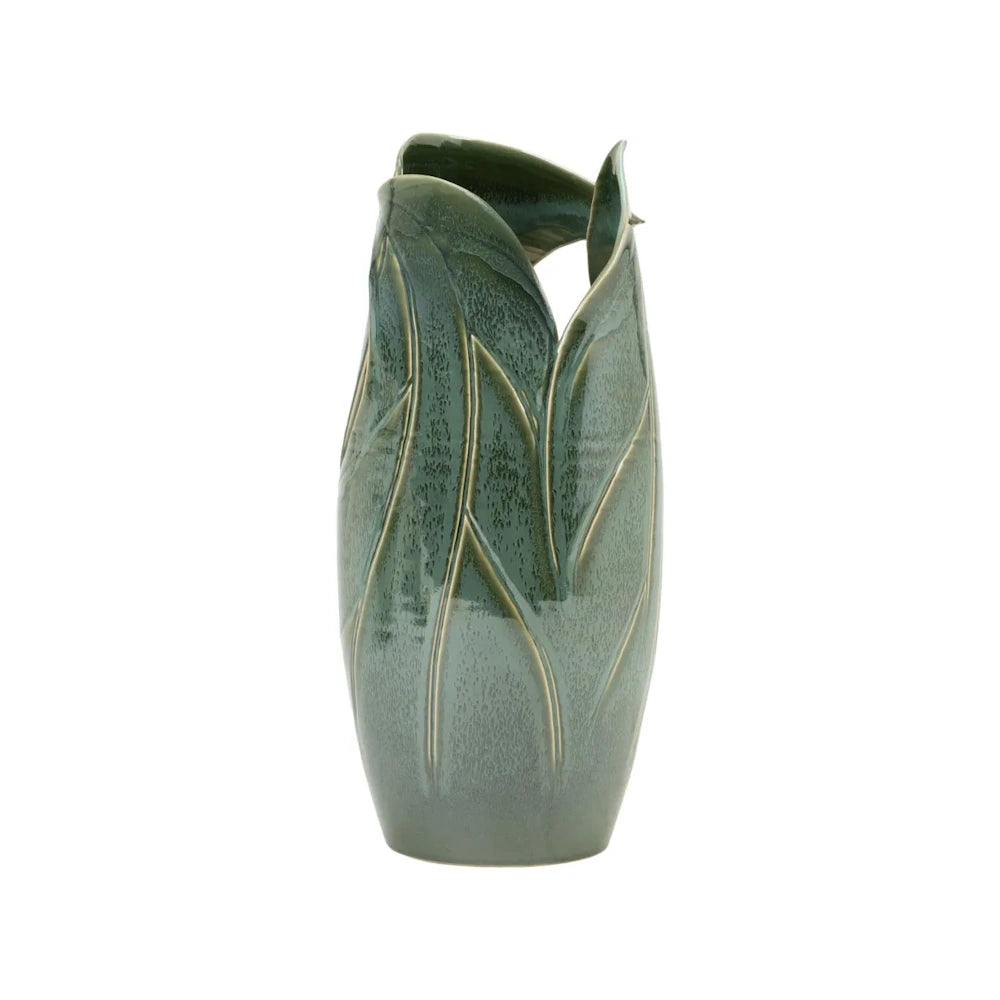 A tall, green ceramic vase shaped like overlapping organic leaves with a glossy glaze, on a white background.