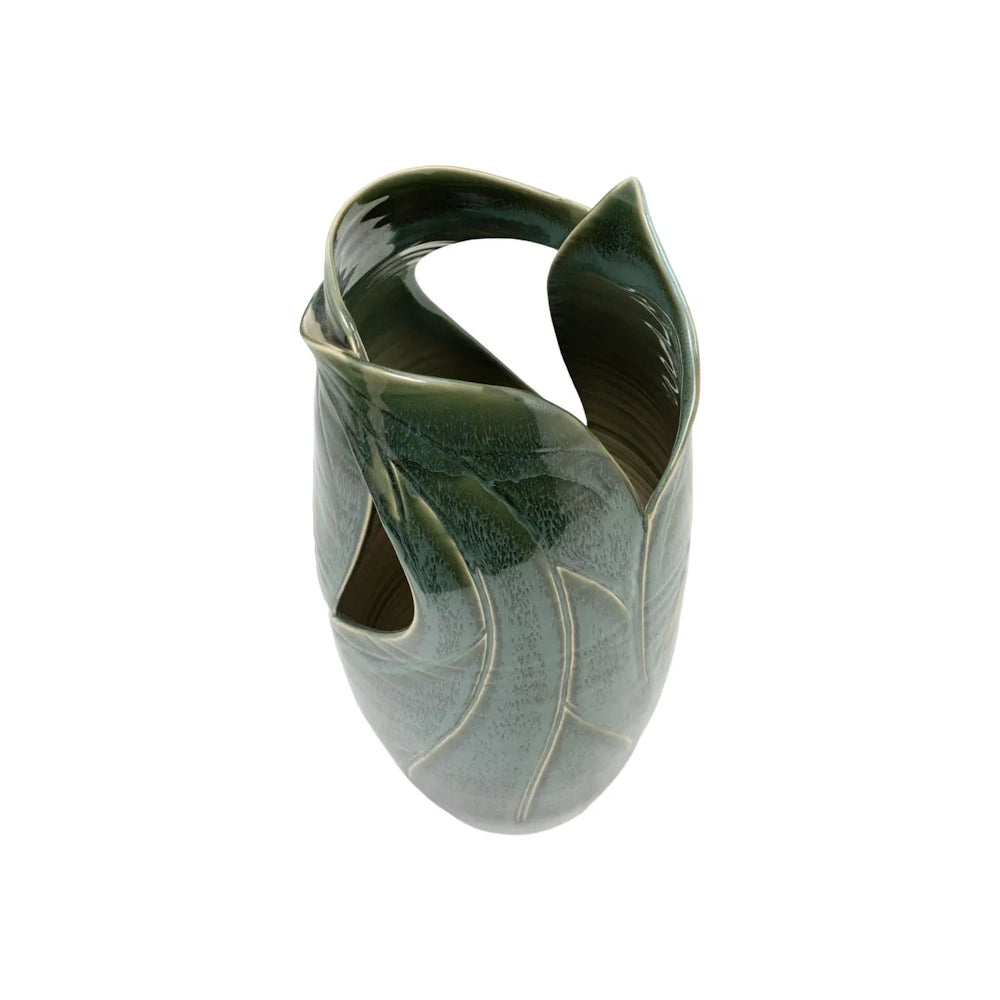 Top-down view of a green textured ceramic vase featuring overlapping, sculptural leaf shapes.