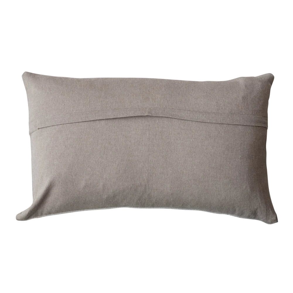 Back view of a neutral beige lumbar pillow featuring a horizontal envelope flap closure.
