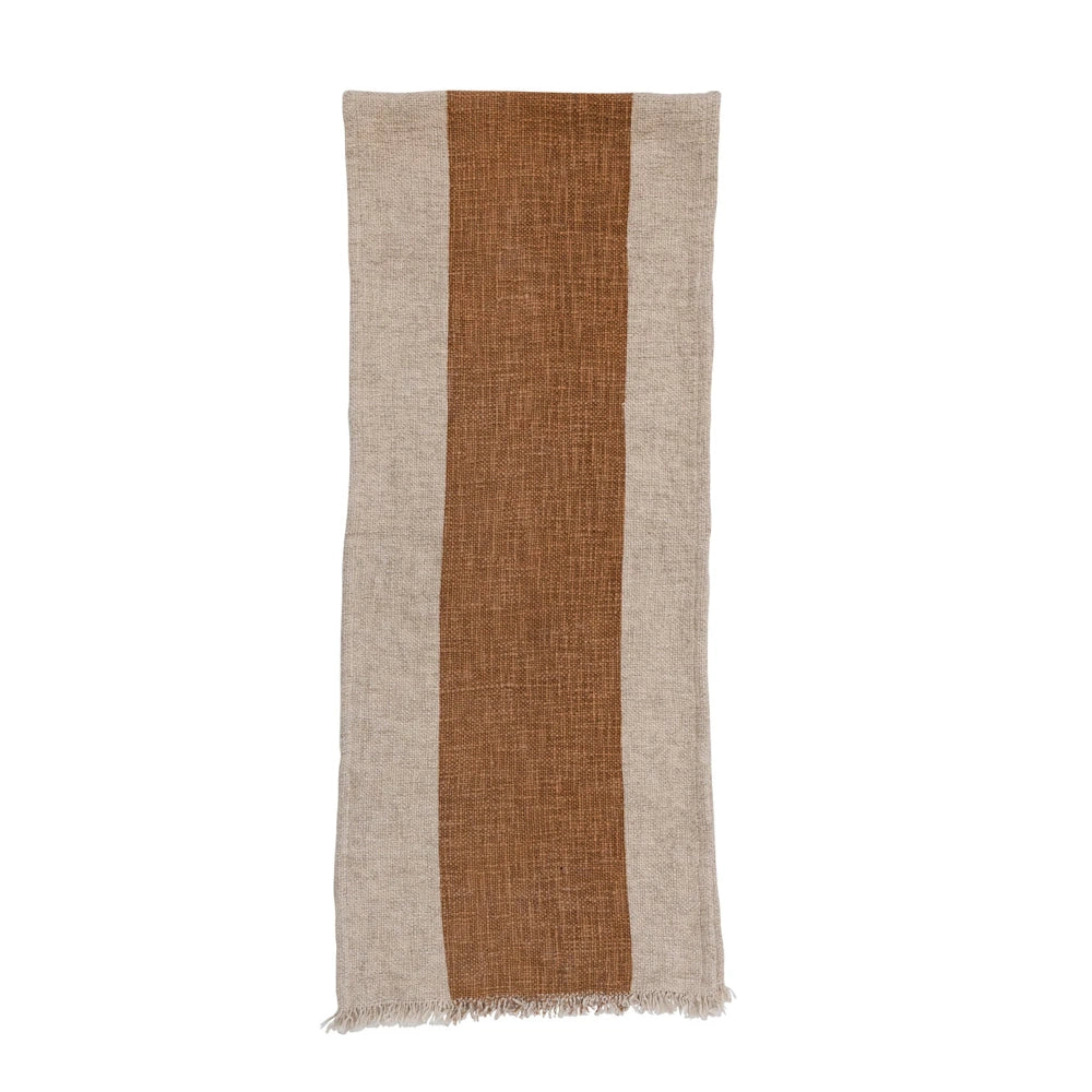 Woven cotton-linen table runner featuring a thick brown center stripe, beige borders, and frayed edges.