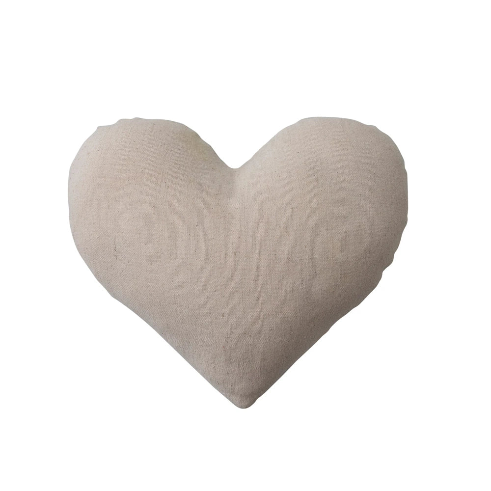 Back view of a plain heart-shaped cotton linen tooth fairy pillow in a neutral cream color.