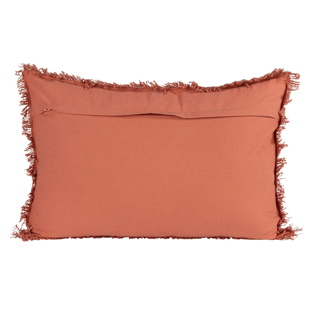 Burnt orange boho throw pillow with fringe trim, rectangular decorative cushion cover for sofa or bed decor.