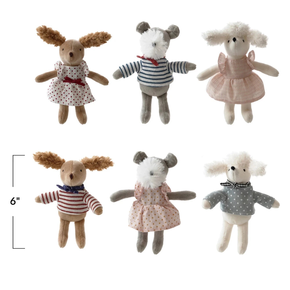 Set of six small, 6-inch plush dog dolls wearing assorted patterned cotton dresses and sweaters on a white background.
