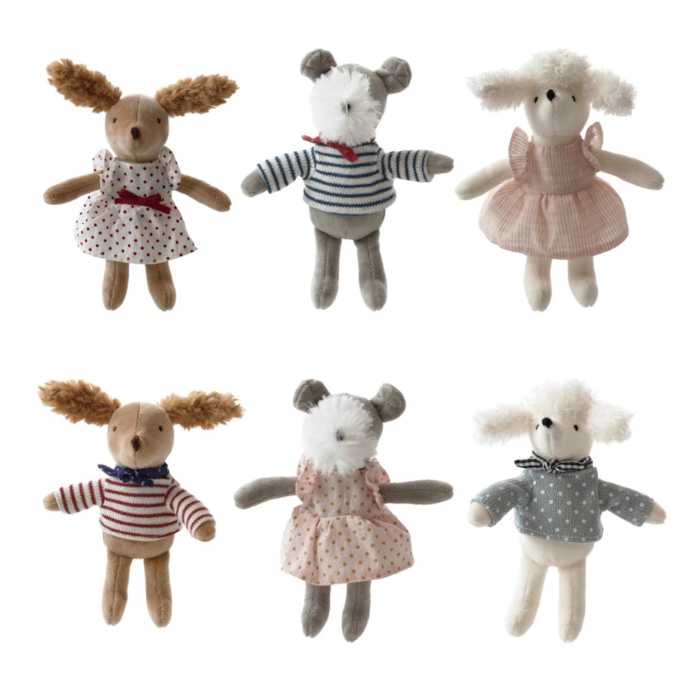 Six small plush dog dolls wearing various outfits, including striped shirts and polka dot dresses, for kids' play.