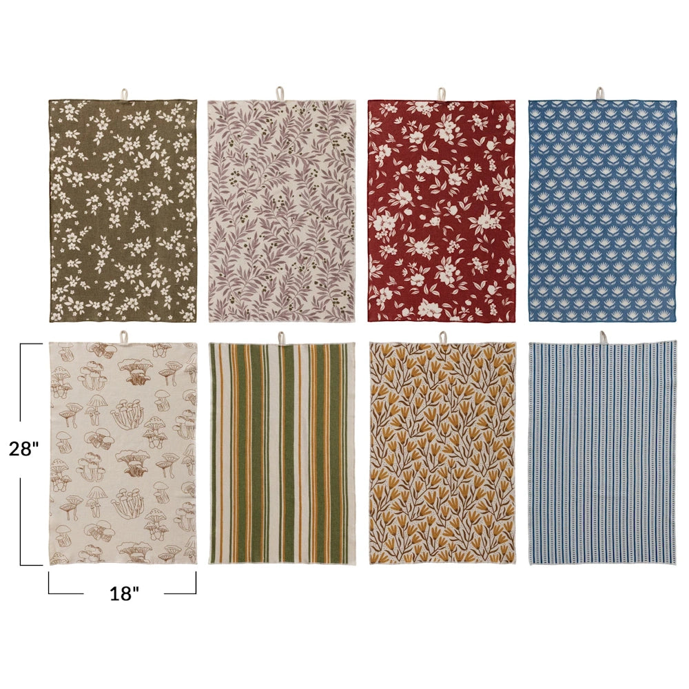 Set of 8 colorful 18"x28" cotton printed terry cloth tea towels with floral, mushroom, stripe, and leaf patterns.
