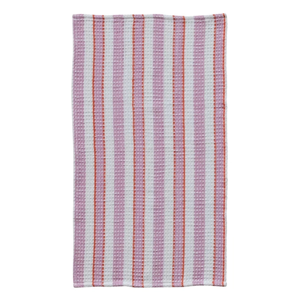 Pink and white striped cotton waffle weave tea towel with orange accents on a white background.