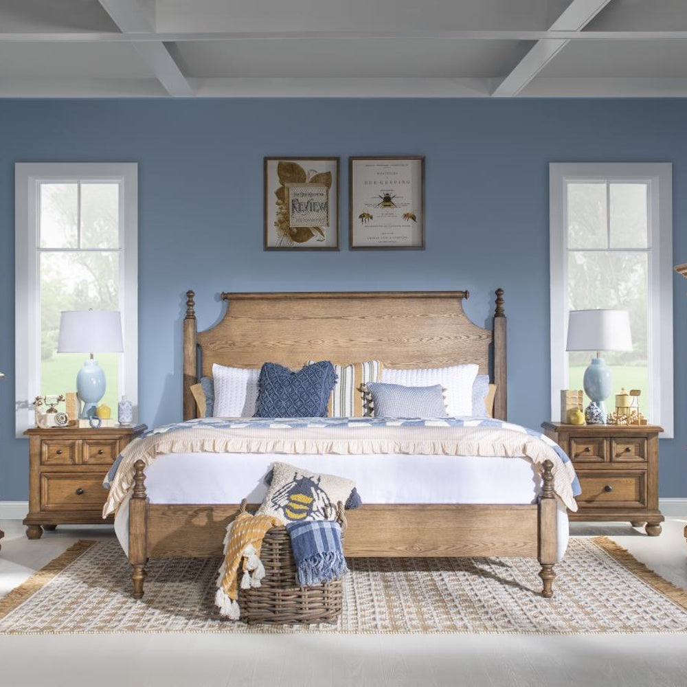 Rustic wood bed with matching nightstands, blue accent wall, and soft blue and white bedding.