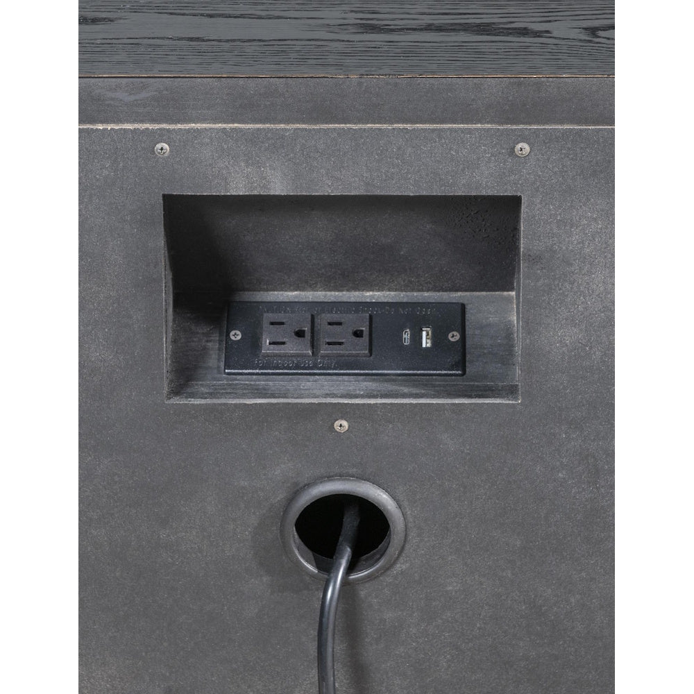 Close-up of built-in power station with two outlets, USB ports, and cord management opening.