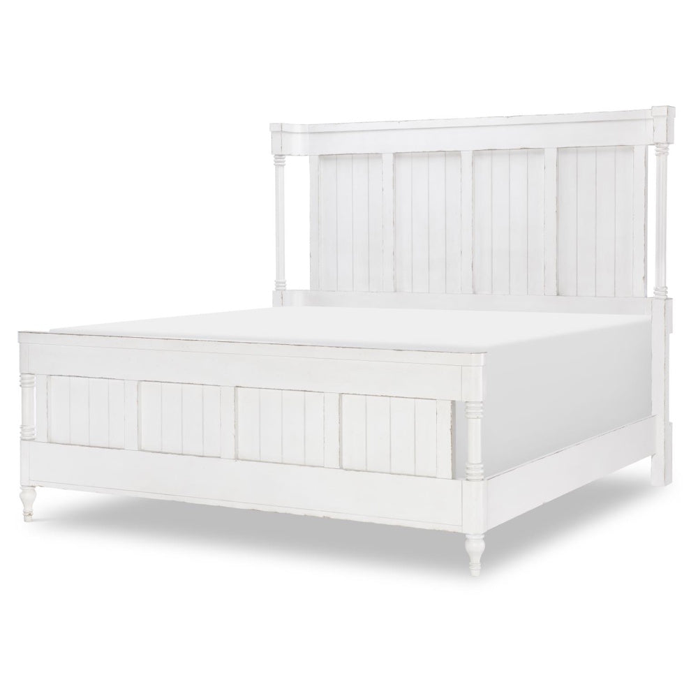 White queen bed with paneled headboard and footboard, turned posts, and distressed farmhouse finish.