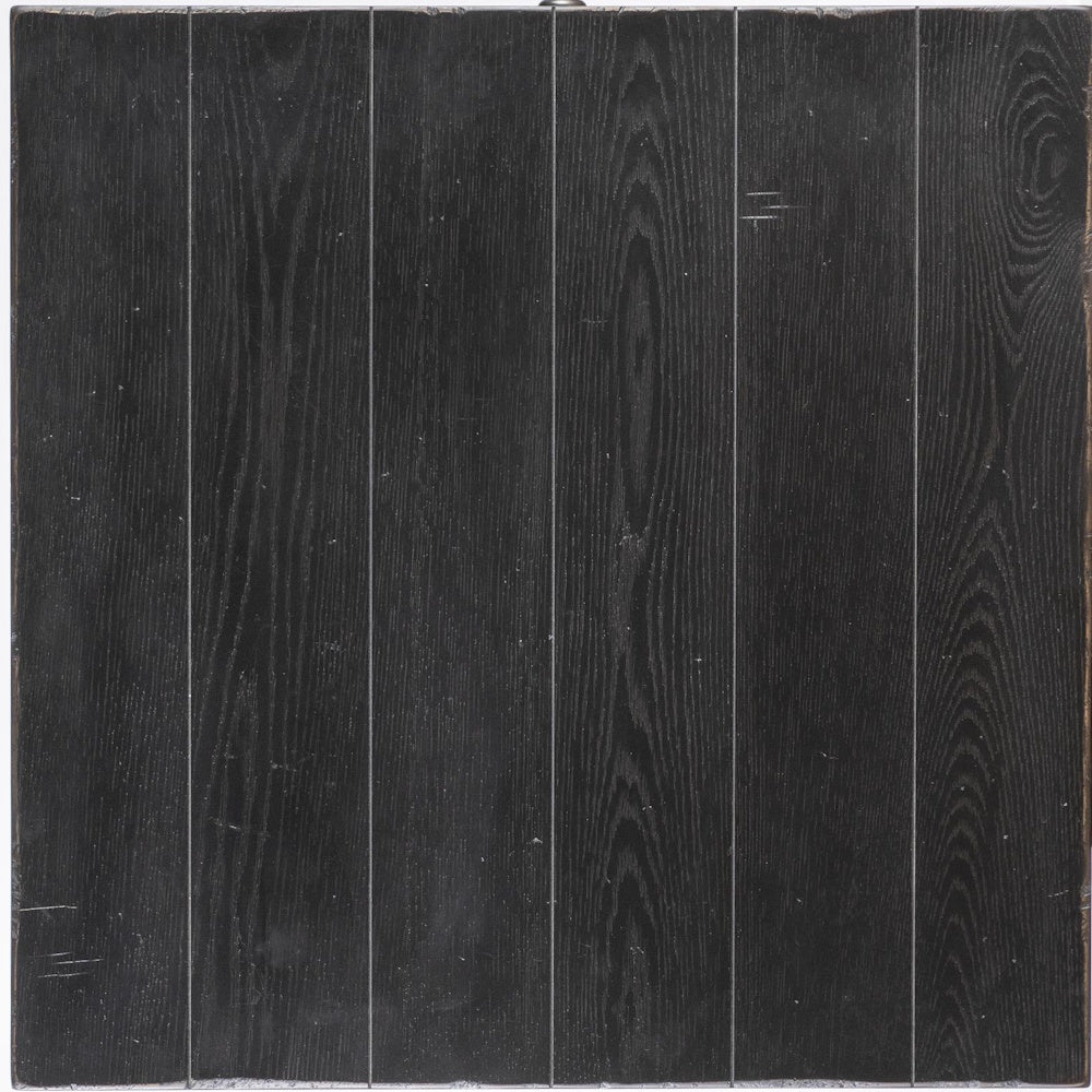 Close-up swatch of country-living-round-dining-table-base-finish.jpg showing a black plank wood finish.