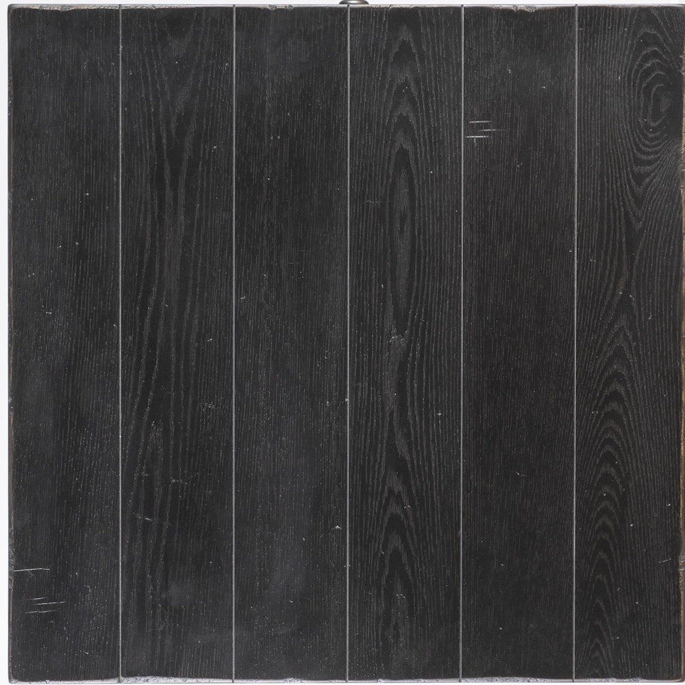 Close-up of black wood finish with visible grain, distressed texture, and plank-style panel detailing.
