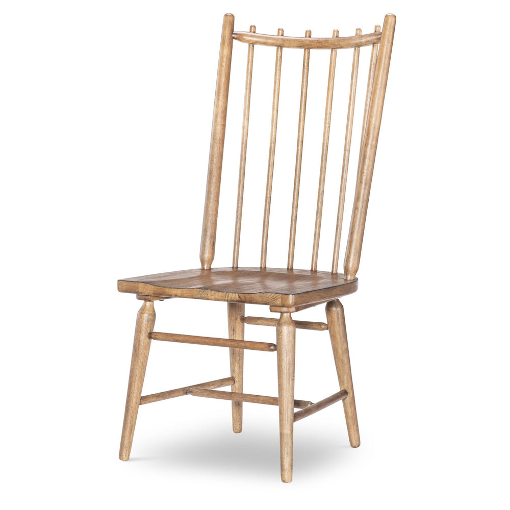 A rustic, light brown wooden spindle-back dining chair on a white background.